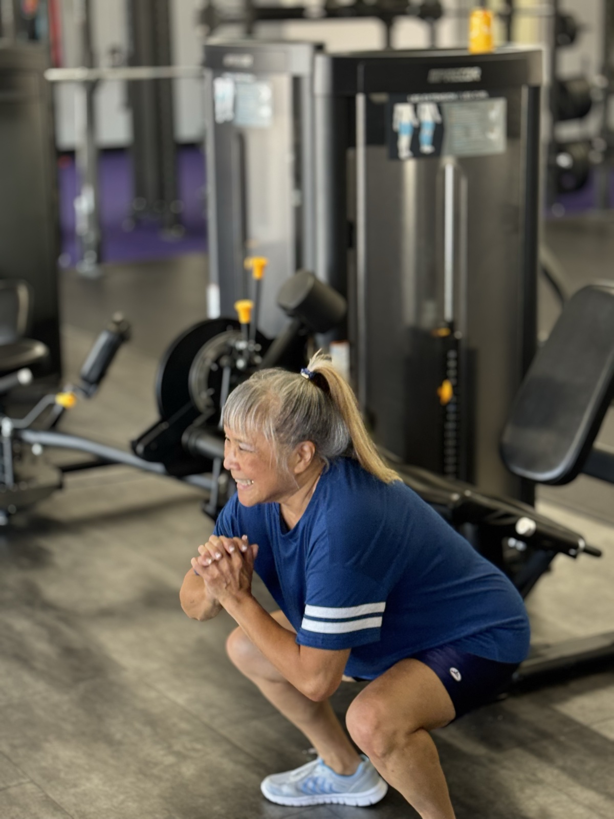 Senior member building functional strength with a coached squat